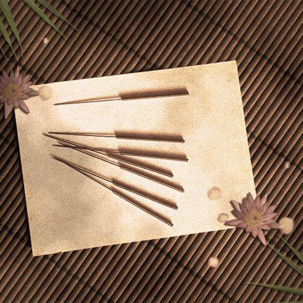 acupuncture needles on a white substrate and a bamboo napkin